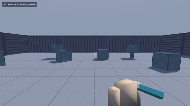 A first-person view across a grey tiled room ringed by dark panelled walls: blue-grey crates and three pedestals stand ahead, a small crosshair sits at the centre of the frame, the view model and its teal prop fill the bottom corner, and a chip in the top corner reads that no pedestals are lit and nothing is in reach.