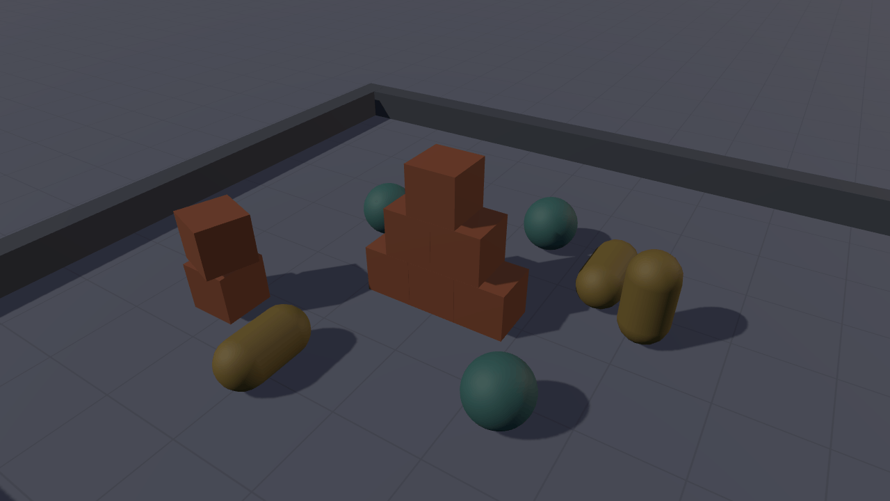 A settled pile of dark orange crates, teal balls and sand-coloured capsules resting on a grid floor inside a low kerbed pit, lit from the upper left and casting soft shadows.